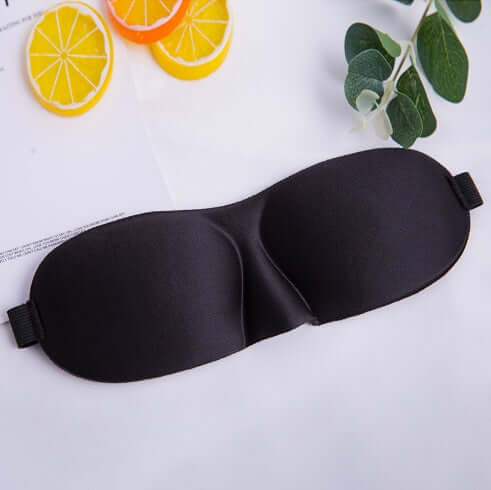 Sleep mask in black color designed for ultimate comfort and restful sleep, featuring a unique shape for free eye movement.