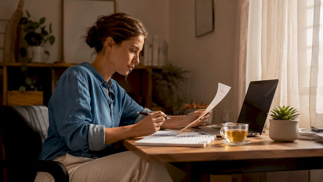 Woman reviewing sleep supplements list at kitchen table
