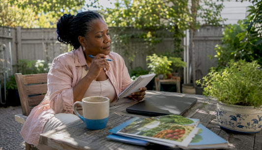 Woman researching wellness products at kitchen table