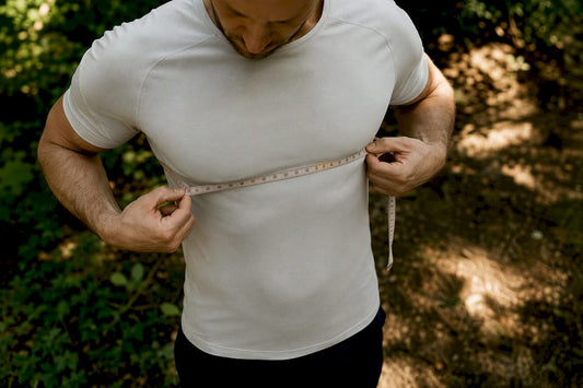Person measuring chest over thin shirt