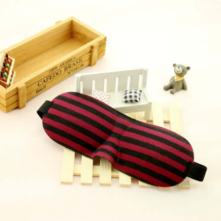 Sleep mask designed for ultimate comfort with soft polyester and sponge material for a restful night.