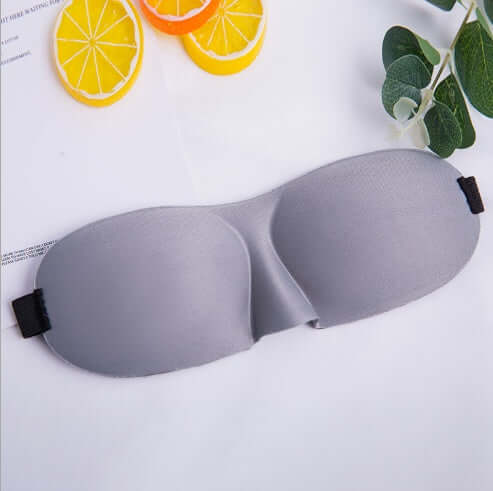 Sleep mask in gray color designed for ultimate comfort and light blocking for restful sleep.