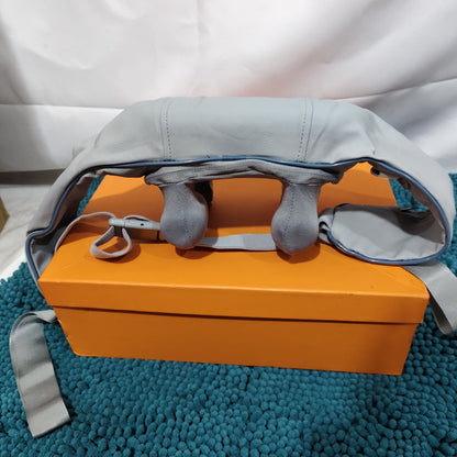 Neck Massager with Soothing Heating Mode on an orange box, designed for relieving tension and providing comfort.