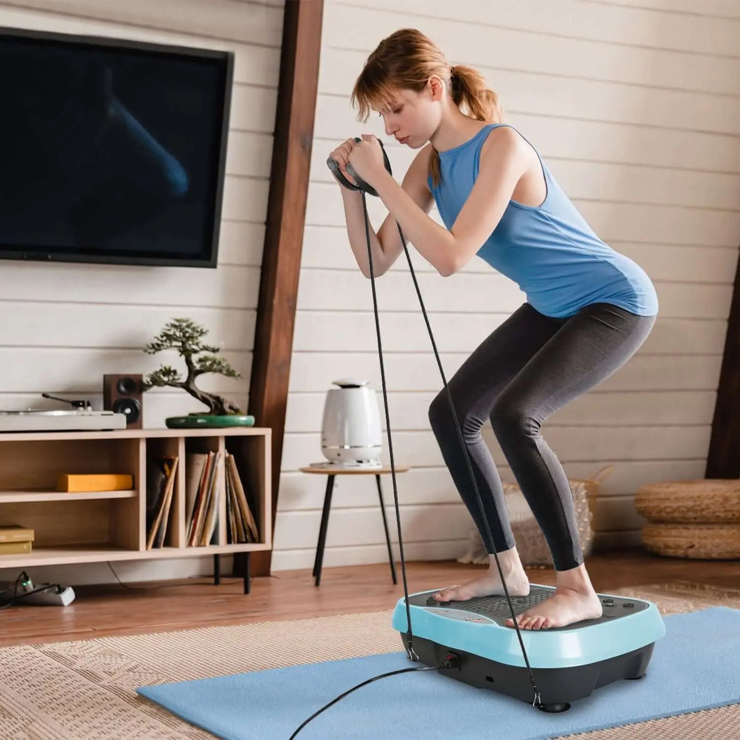 Woman using Vibration Plate Exercise Machine at home for fitness training and strength building.