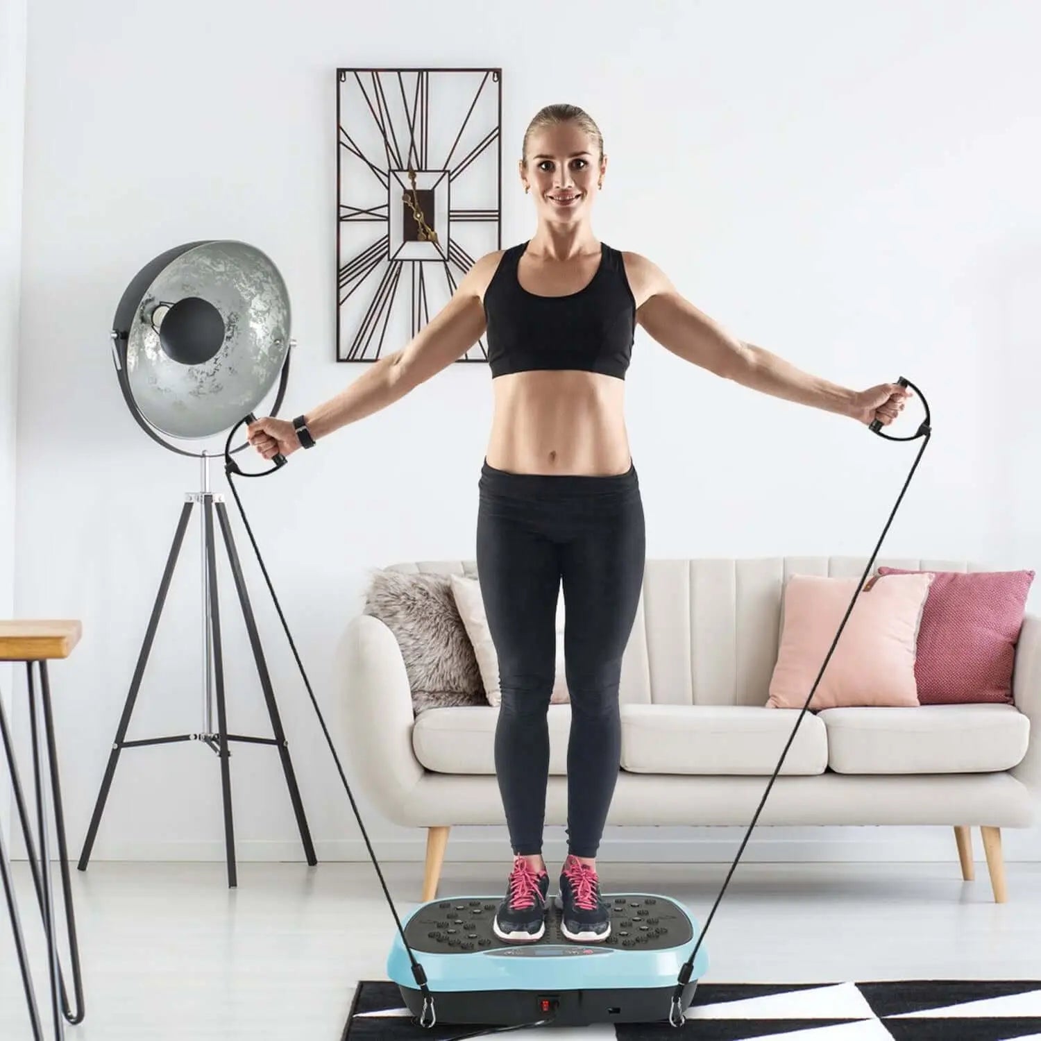 Woman using Vibration Plate Exercise Machine for home fitness with adjustable vibration speeds.