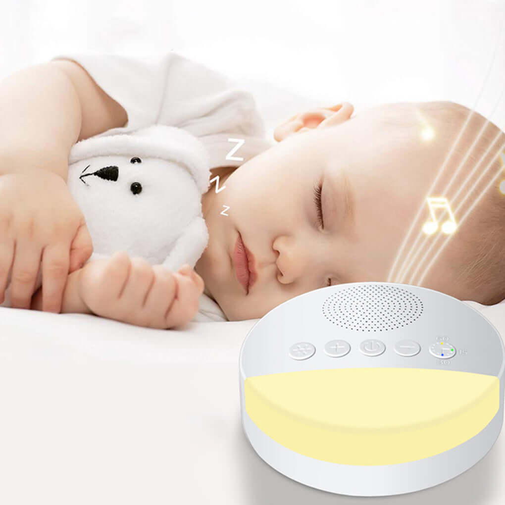 Baby sleeping peacefully next to a white noise machine, emitting soothing sounds for relaxation.