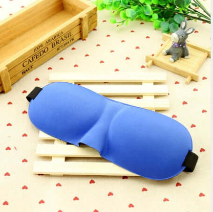 Sleep mask in blue color placed on wooden slats with a decorative background for ultimate comfort.