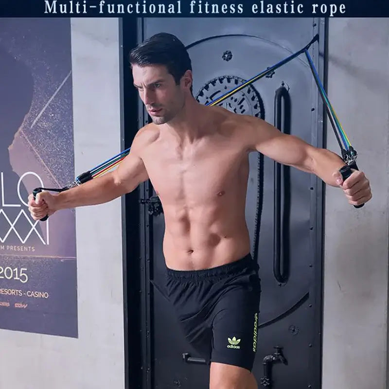 Man using 11-piece resistance bands set for home workouts with multi-functional fitness elastic rope.