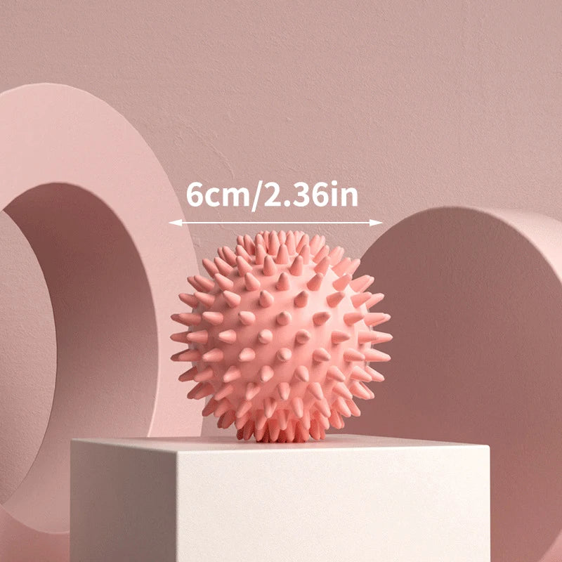 Relaxing Foot Massage Ball in pink with spikes, measuring 6cm/2.36in for portable foot relief.