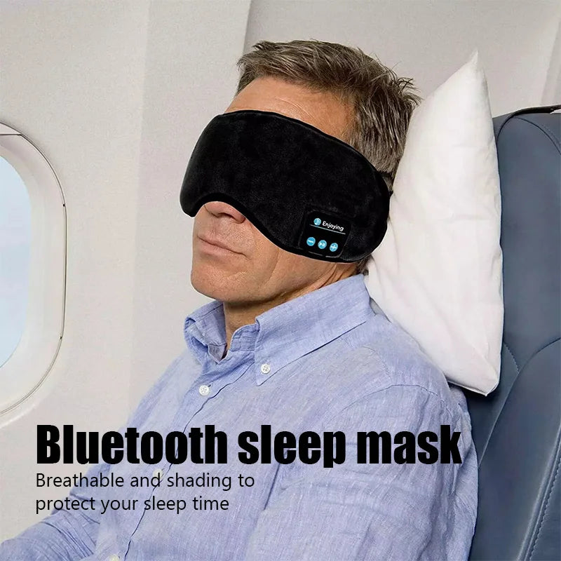 Man wearing Wireless Bluetooth Sleep Mask on an airplane for comfortable sleep and music listening.