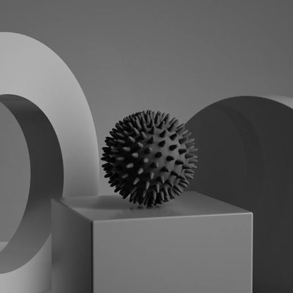 Relaxing Foot Massage Ball on a display pedestal, showcasing its textured surface for tension relief.