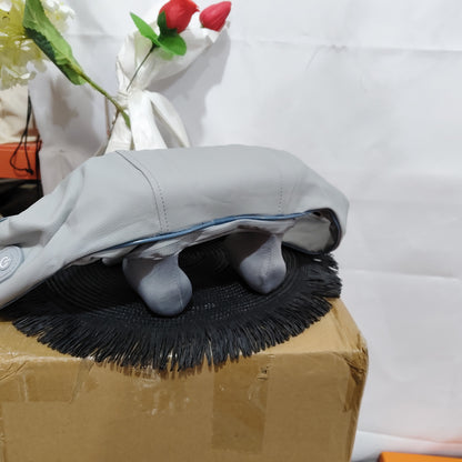 Neck Massager with Heating Mode resting on a fuzzy mat, showcasing its ergonomic design for tension relief.